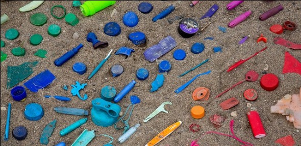 Plastic waste on a beach - 590x288